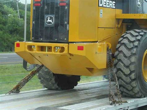 skid steer tie down|tie down requirements for machinery.